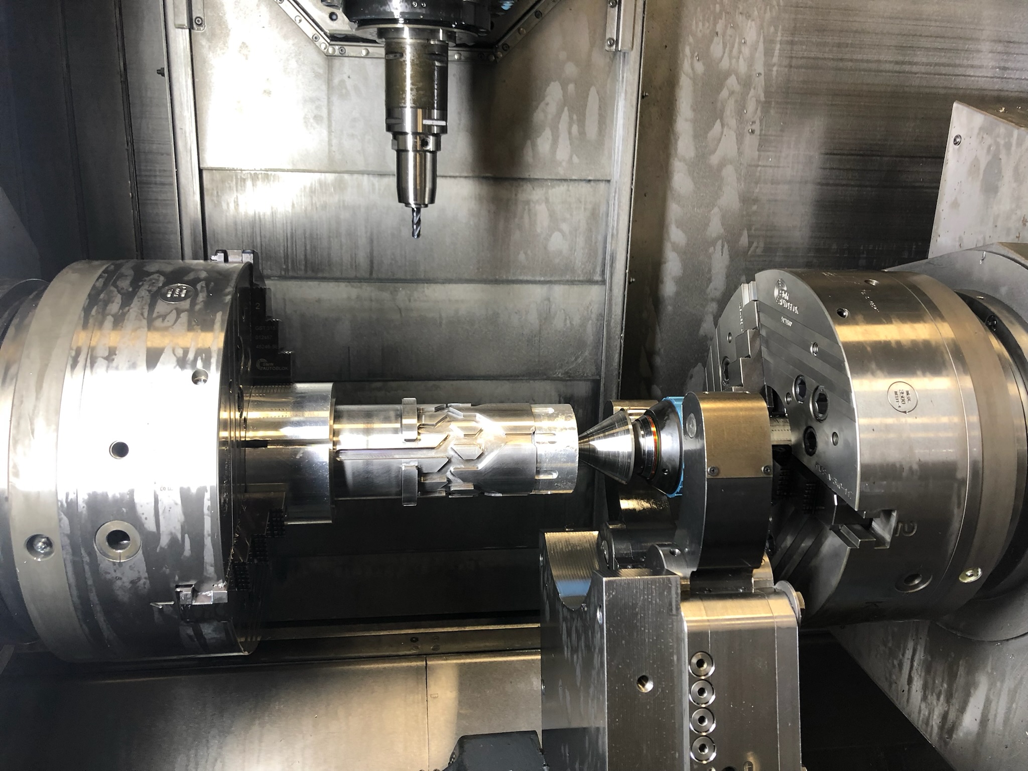 Brass parts being machined on a lathe