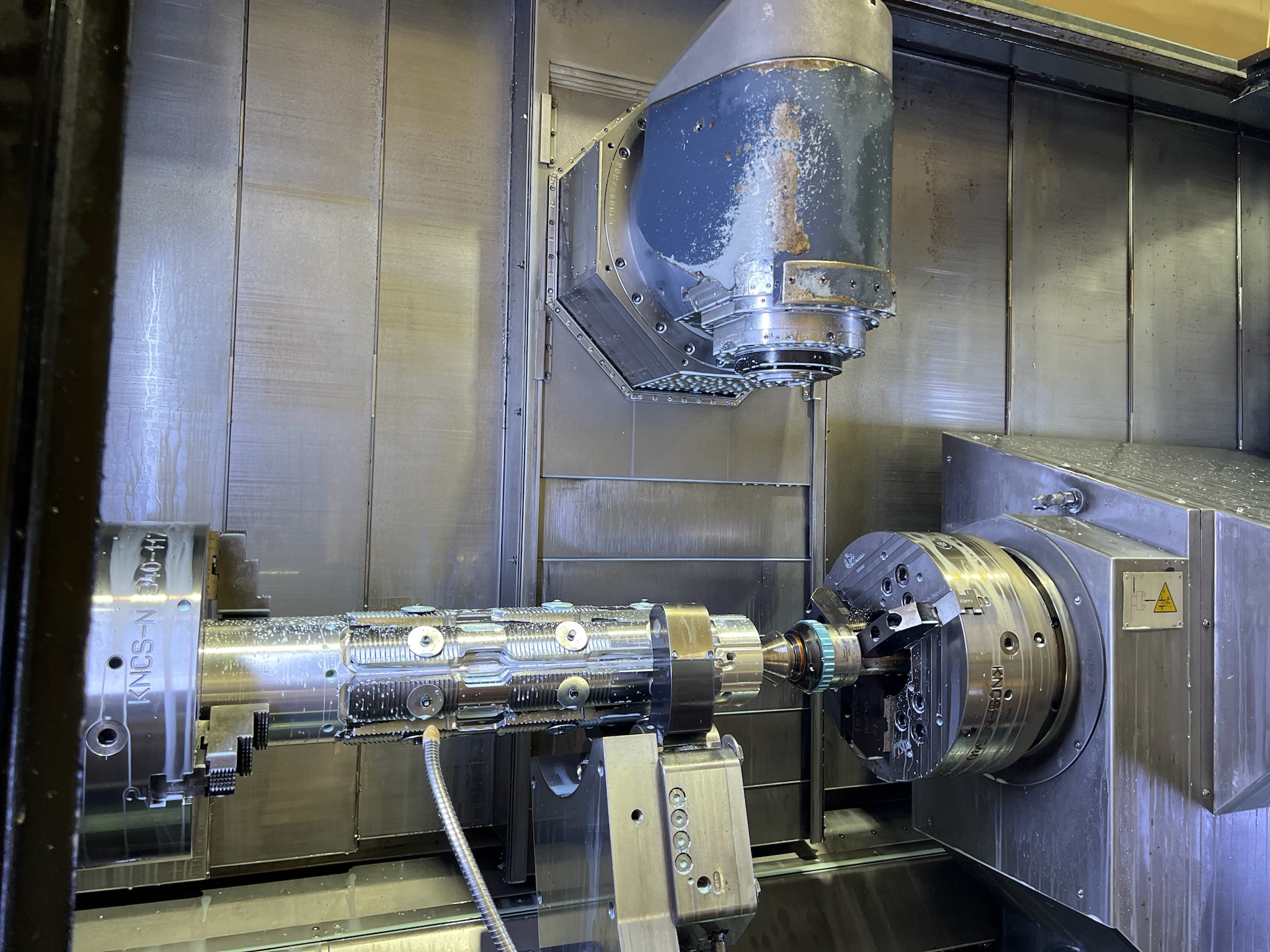 Metal being pressed in a machine