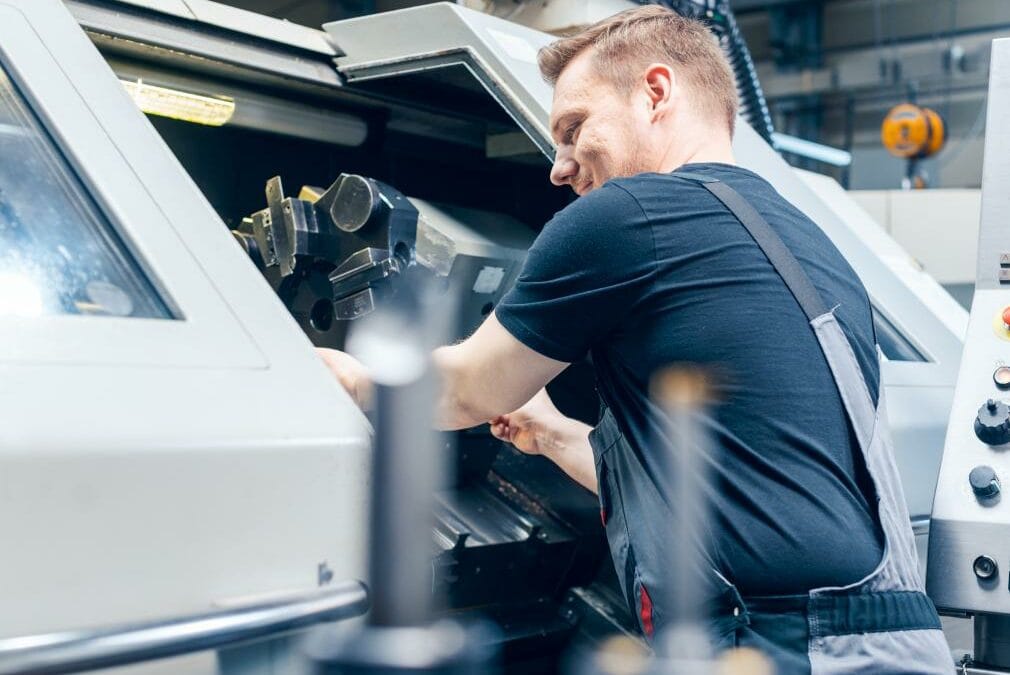 Brass parts being machined on a lathe